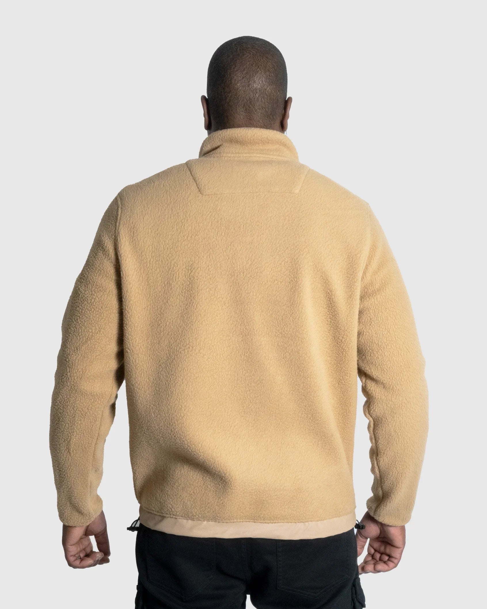 Camel fleece quarter-zip jacket back view with logo patch at hem