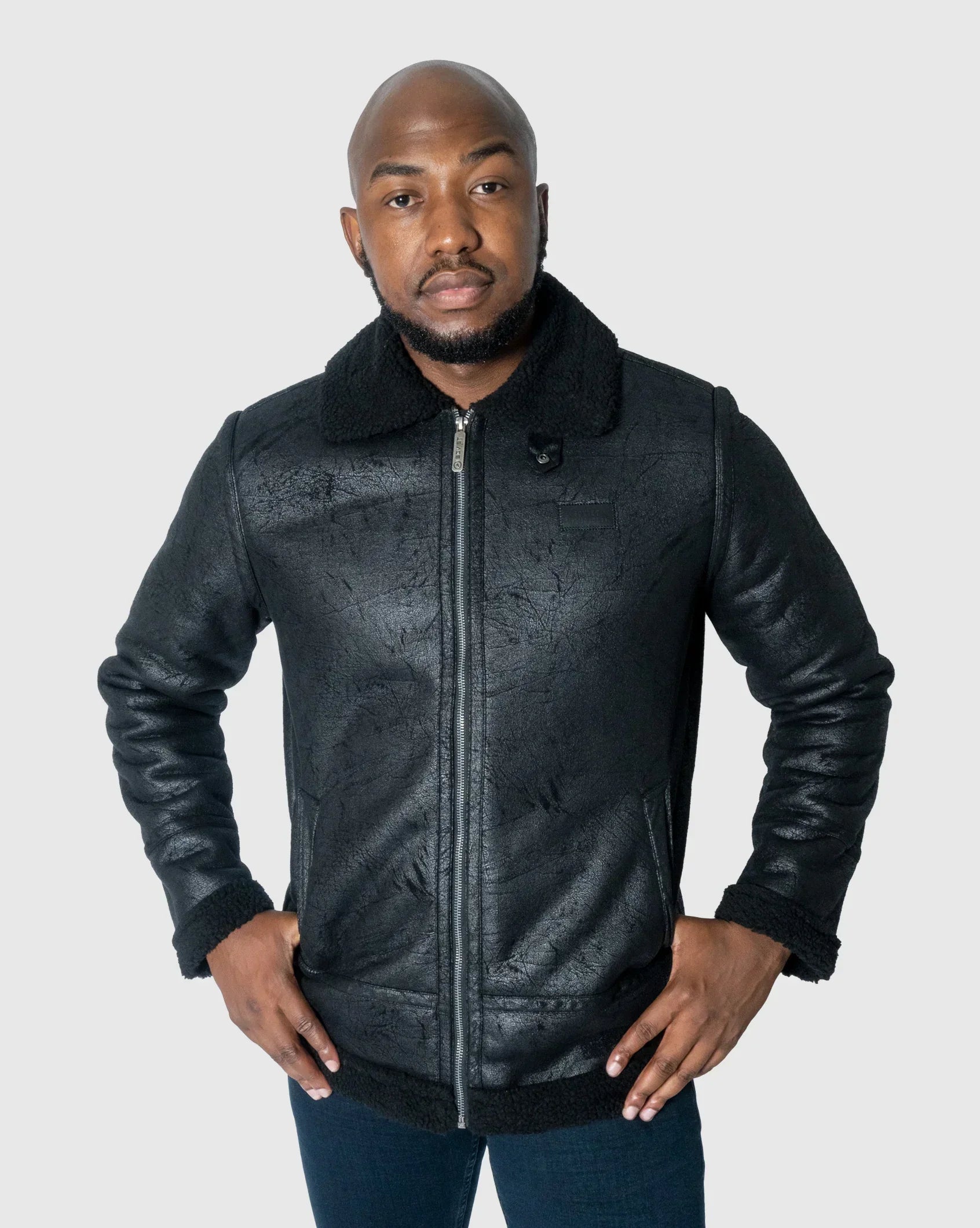 Black faux suede fleece jacket with zip front, sherpa cuffs, and hem