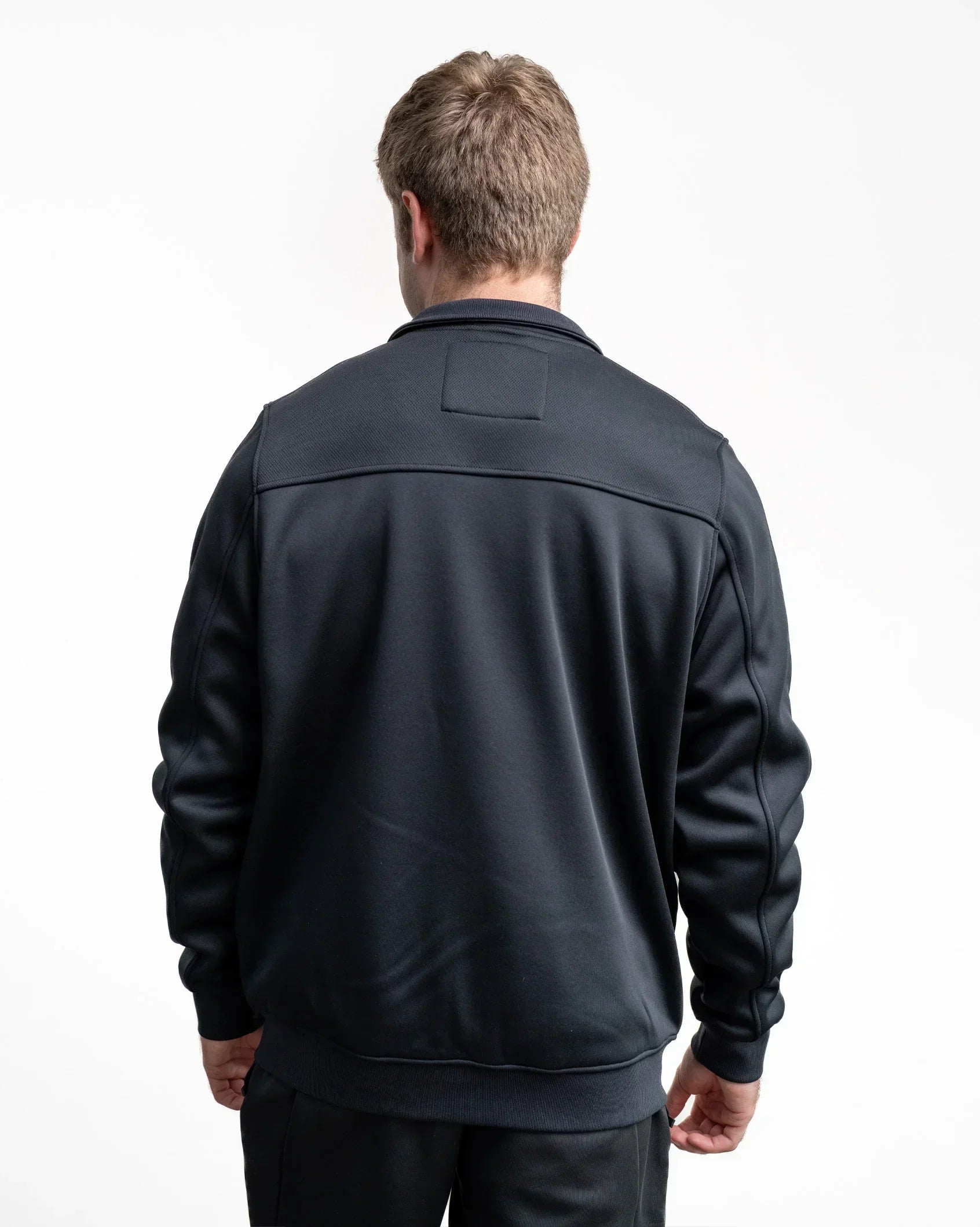 Black zip-up print jacket with stand collar, back view, long sleeves