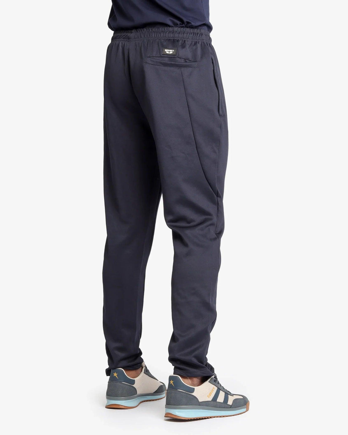 Soviet Mens Aero Skinny Leg Pants in dark fabric, close-up of slim-fit style and waistband details.