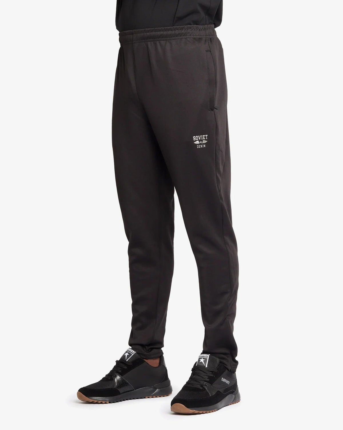 Soviet Men's Aero skinny leg pants in dark fabric, close-up of the stylish, fitted apparel showing details of the slim design.