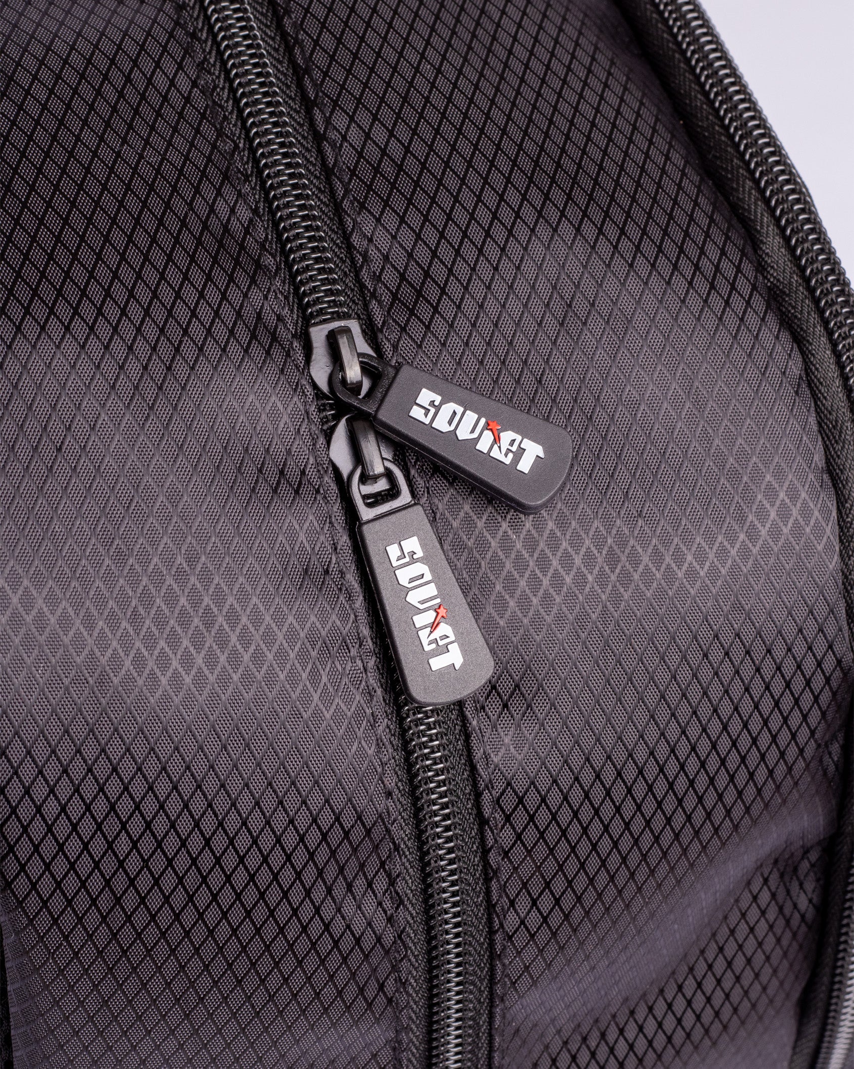 Soviet Ezra print backpack in black with accessory compartments, featuring a stylish design ideal for daily use.