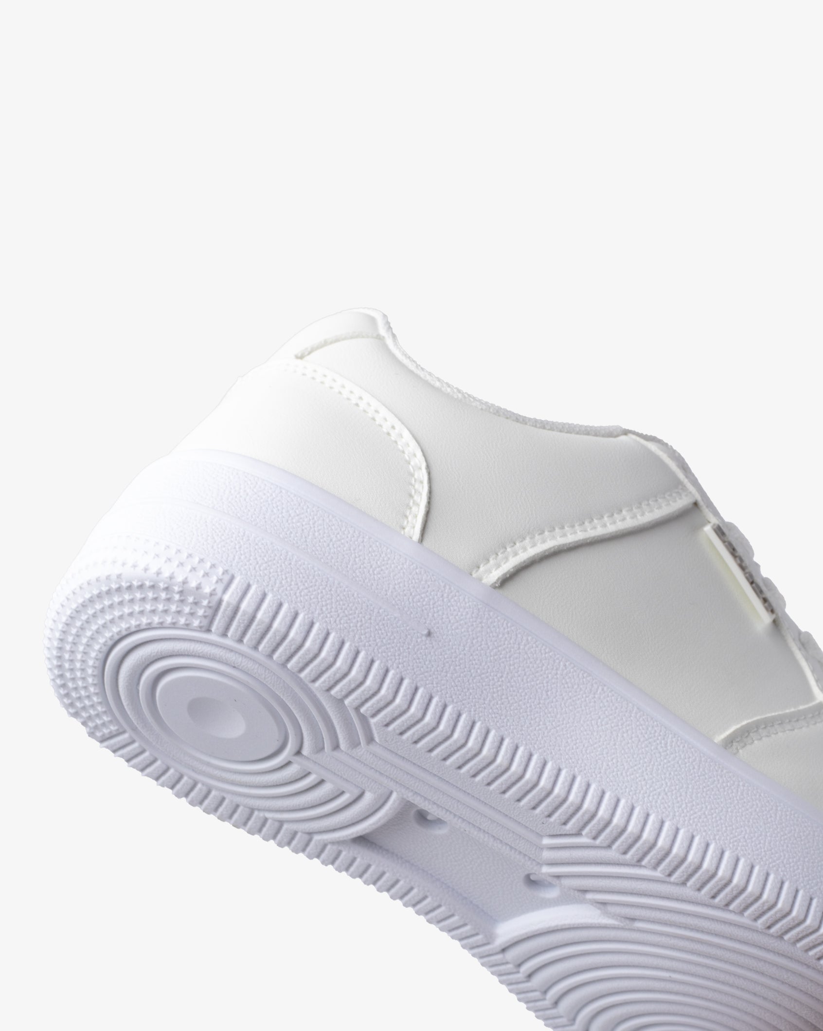 White PU sneaker outsole tread with textured ribbed pattern