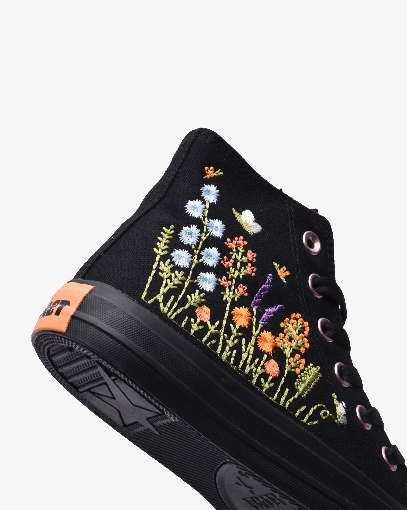 Soviet Ladies Viper Floral Hi Cut Canvas footwear in black with colorful floral pattern, showing side view of the stylish sneakers.
