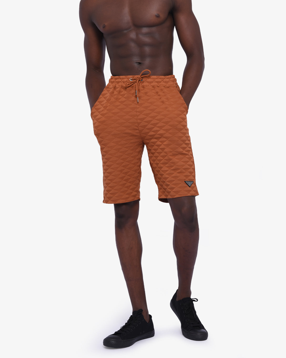 Mens Soviet Ford track shorts in caramel color, featuring athletic design and branded logo on lightweight apparel.
