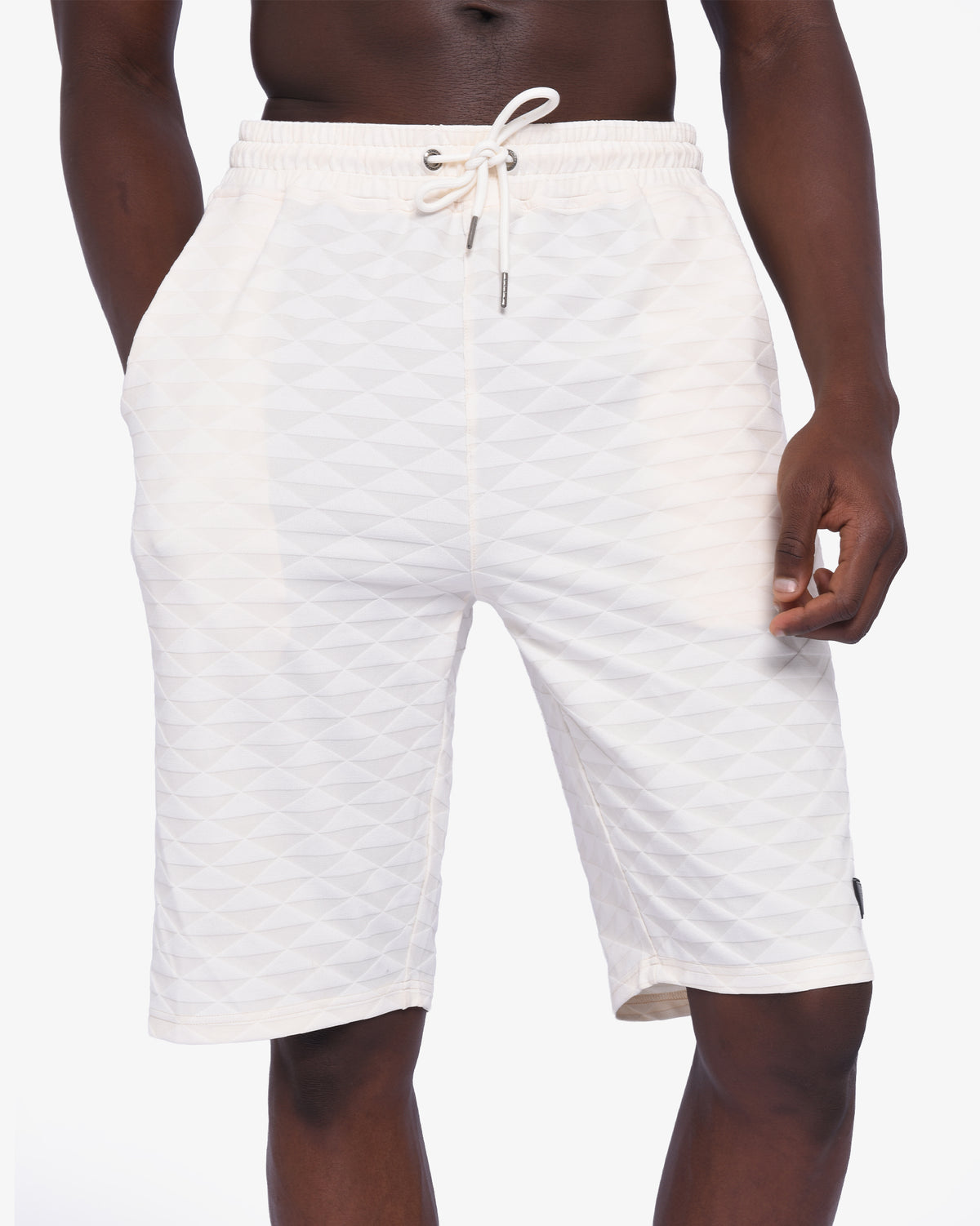 Mens Soviet Ford track shorts in cream color, athletic apparel with elastic waistband and sporty design, front view.