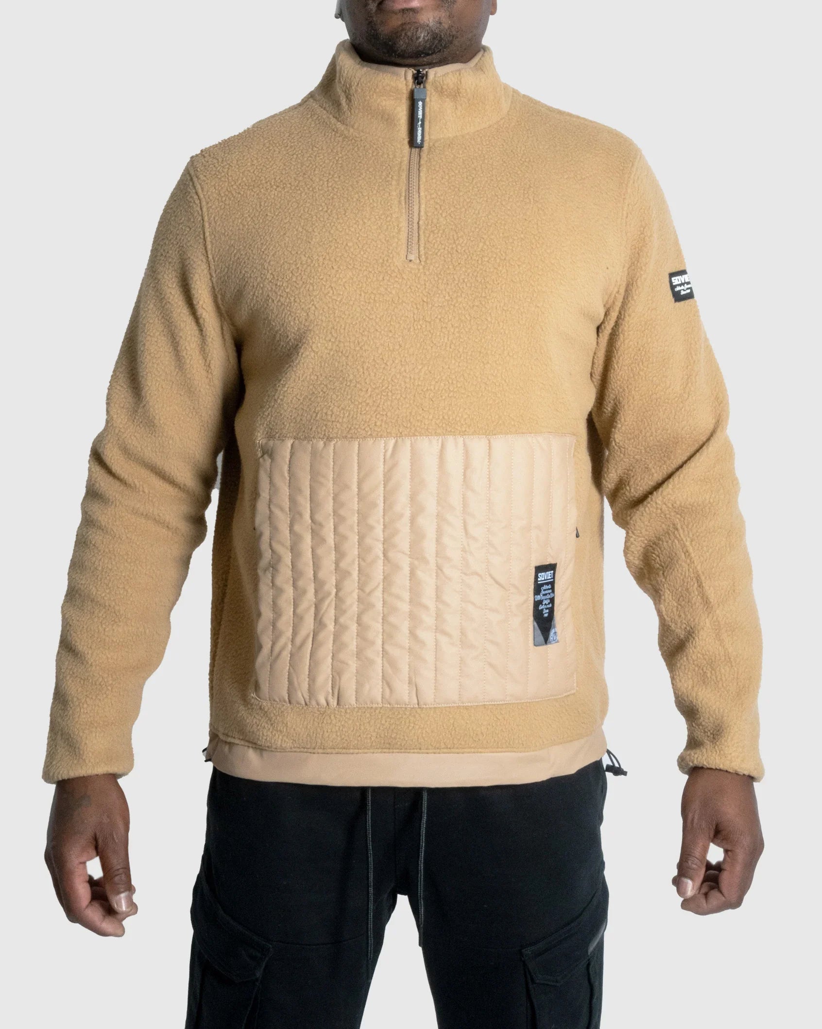 Camel fleece quarter-zip jacket with quilted front panel and chest logo patch