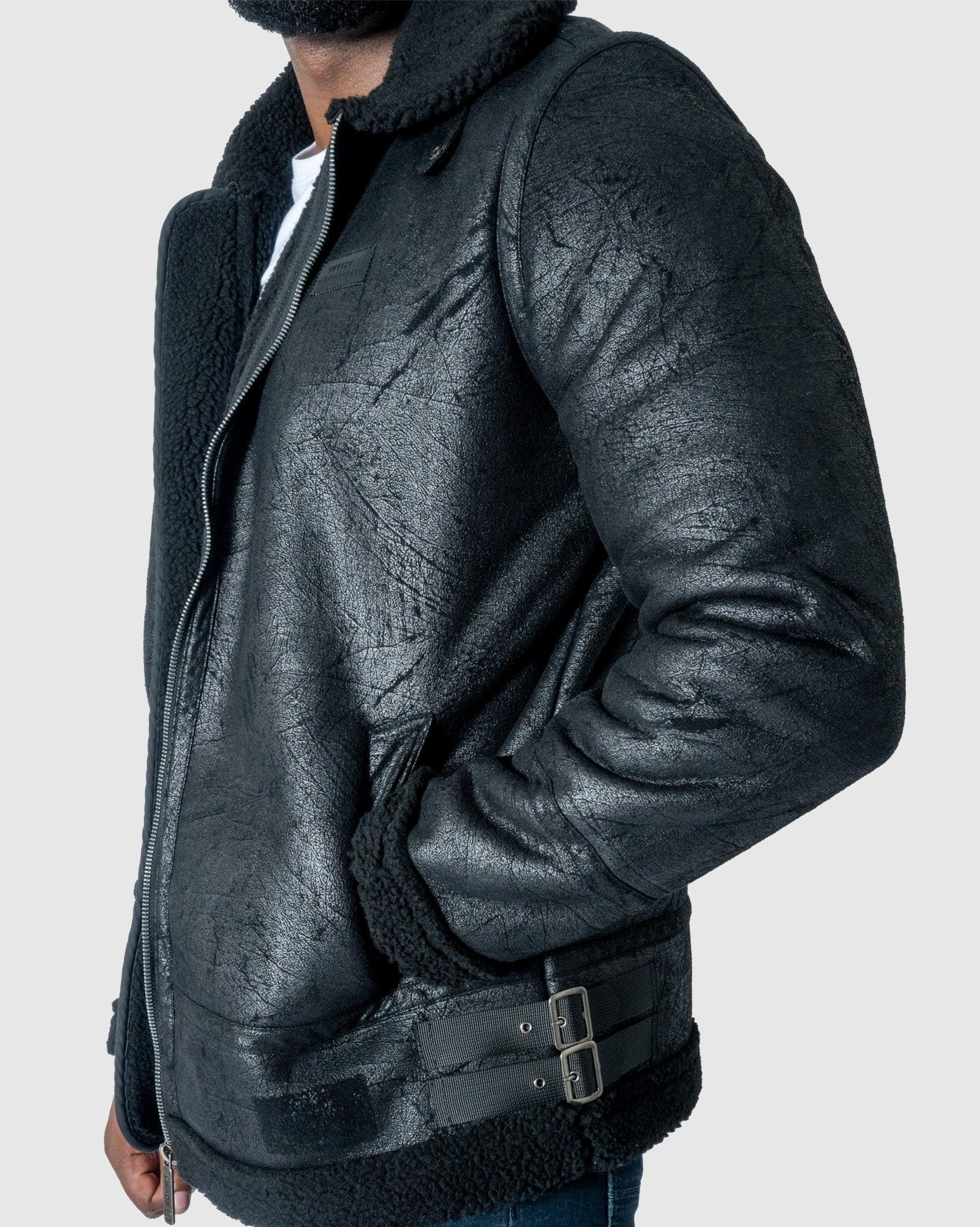 Black faux suede fleece jacket detail with buckled waist strap and zip