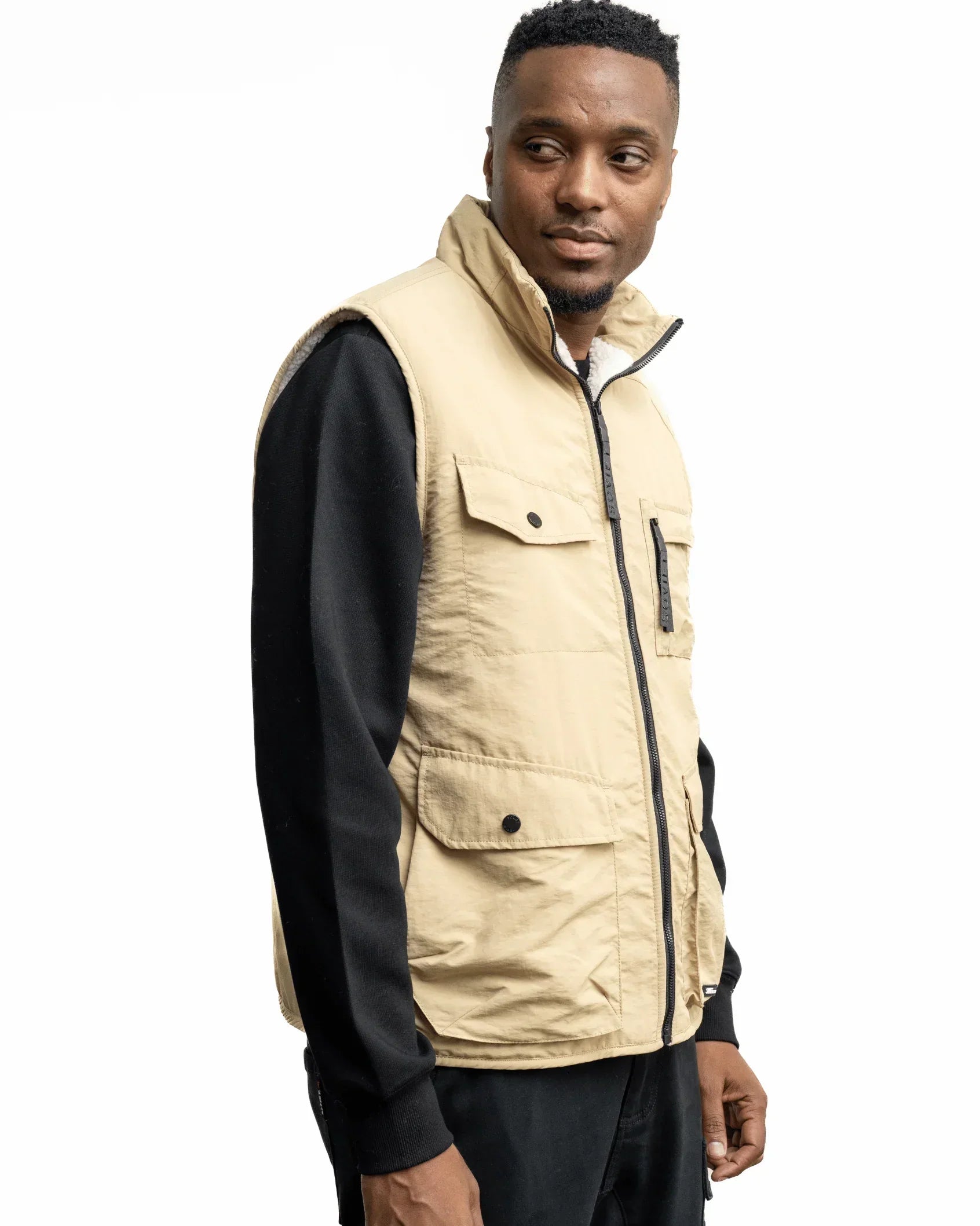 Men's stone fashion gilet with black-trim zip, chest flap pockets, sleeveless fit