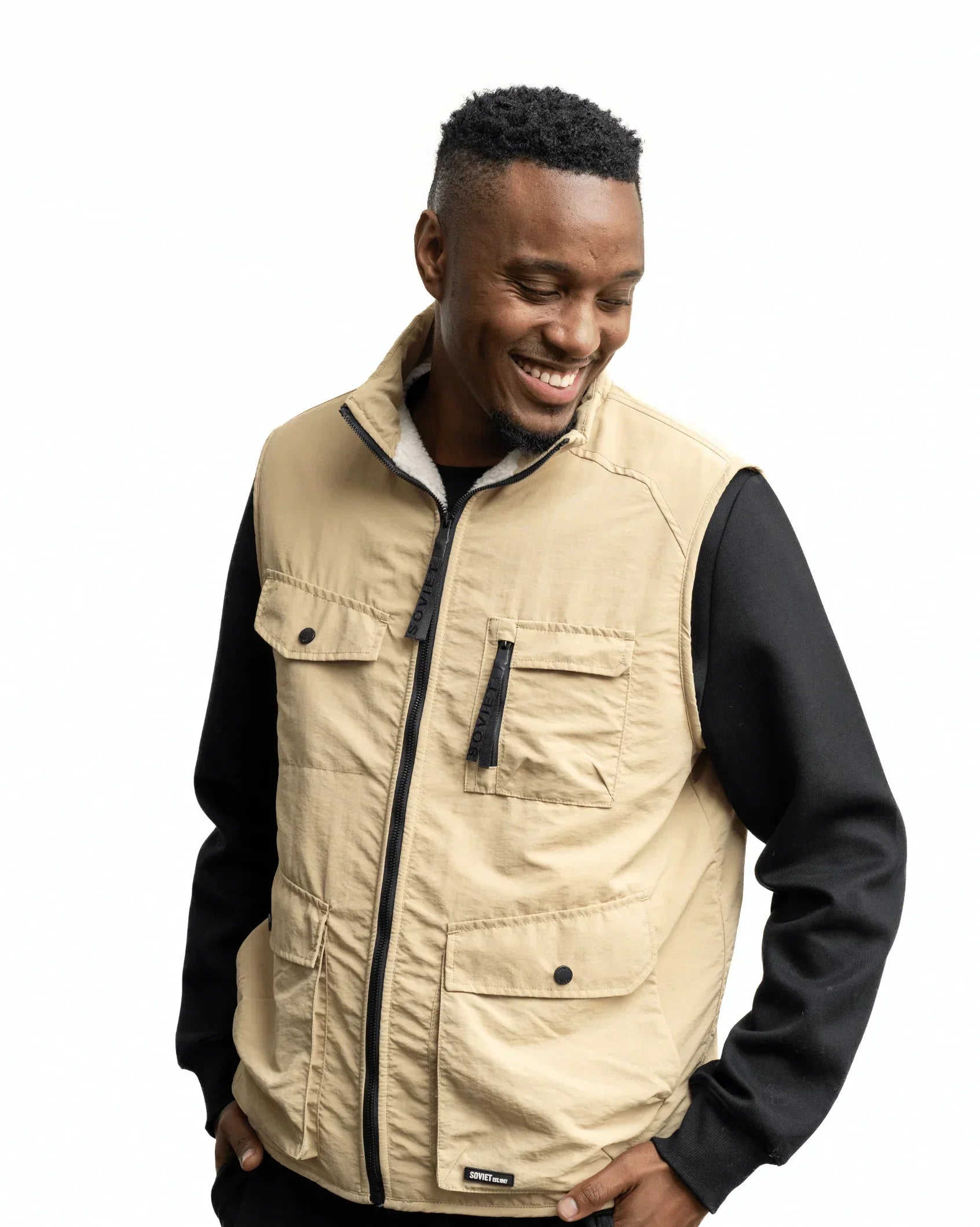 Men's stone fashion gilet front with black zip and flap chest pockets