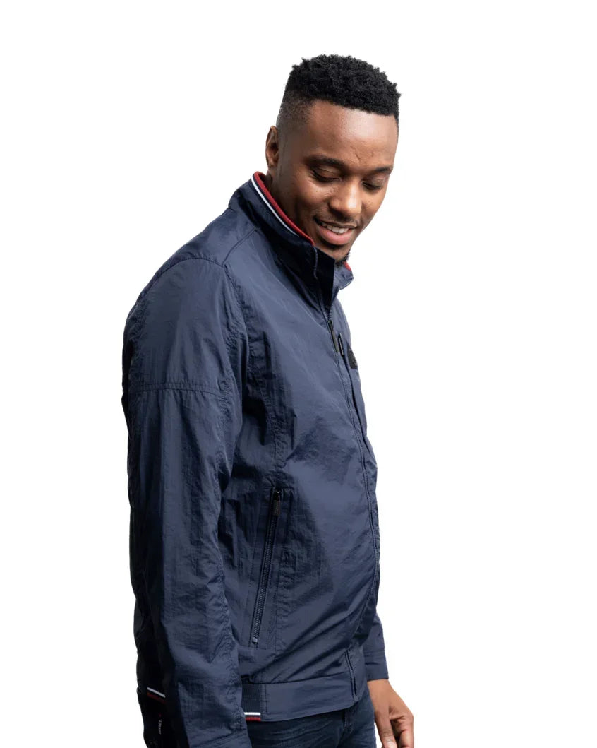 Men's lightweight jacket in navy; zip front and side seam pockets, striped collar lining.