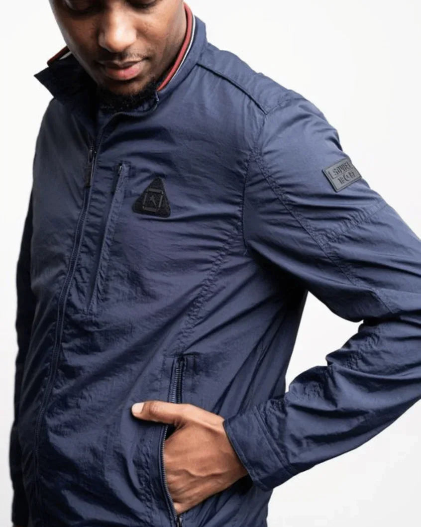 Men's lightweight jacket in navy; zip front and sleeve label, side hand pocket visible.