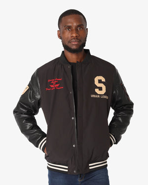Men's Soviet Chandler varsity baseball jacket featuring classic striped cuffs and a team-inspired design, displayed on a hanger.