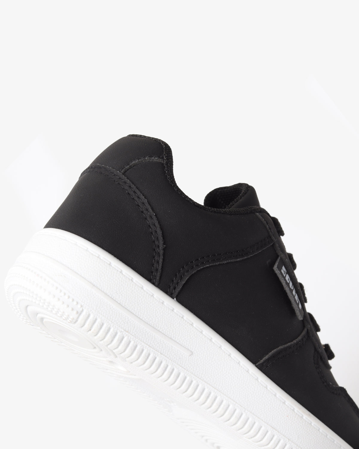 Youth Leandro low cut casual lace-up sneaker by Soviet, black and white footwear with a stylish, minimalist design.