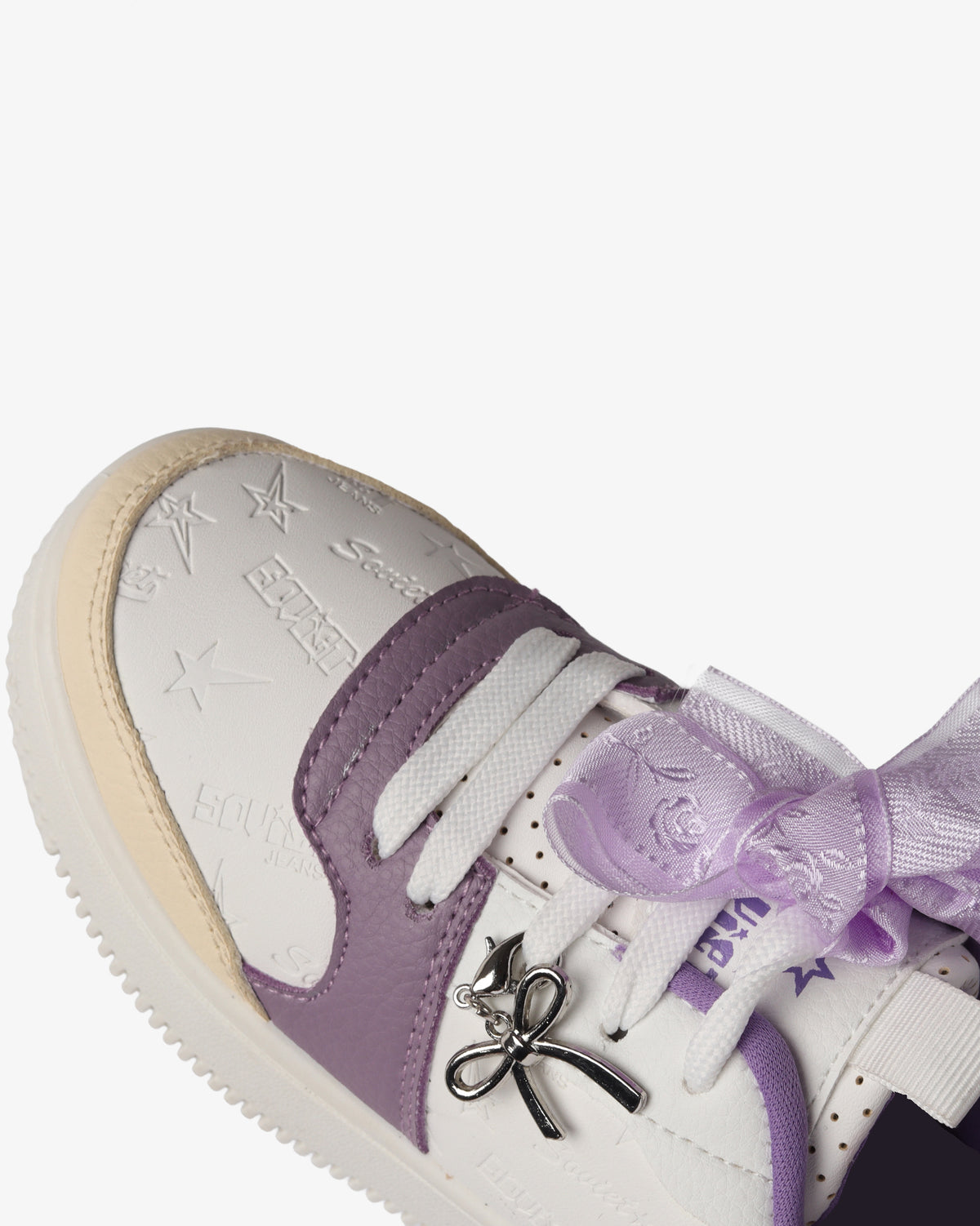Kids Soviet Scarlett low cut casual platform sneaker in white and beige with lilac accents, featuring a comfortable slip-on design.