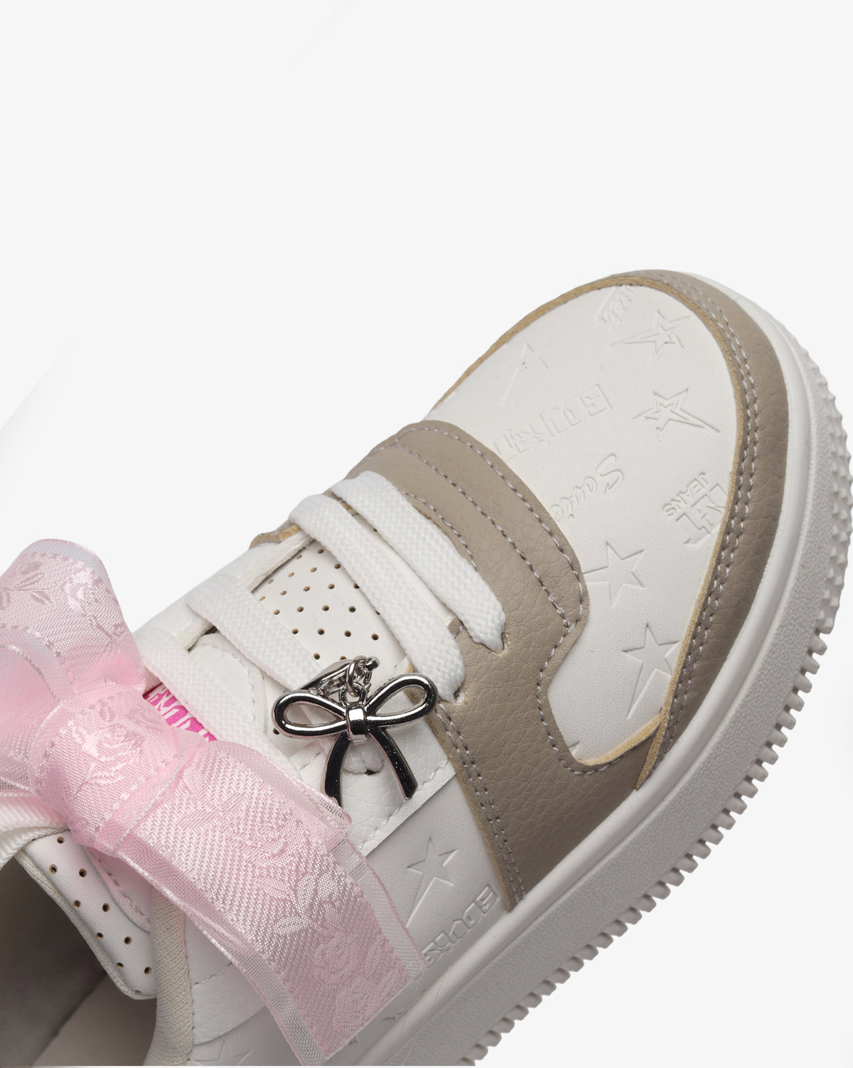 Kids Scarlett low cut casual platform sneaker by Soviet in white, pink, and black with colorful laces and a thick sole.