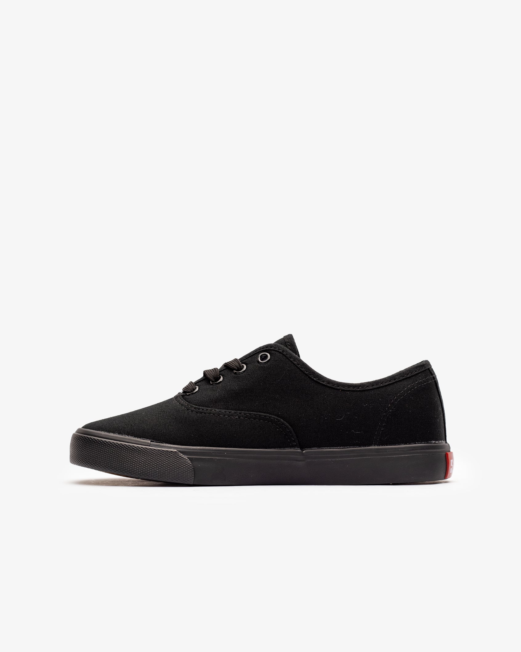 Black low-top canvas sneaker with lace-up front and flat rubber sole