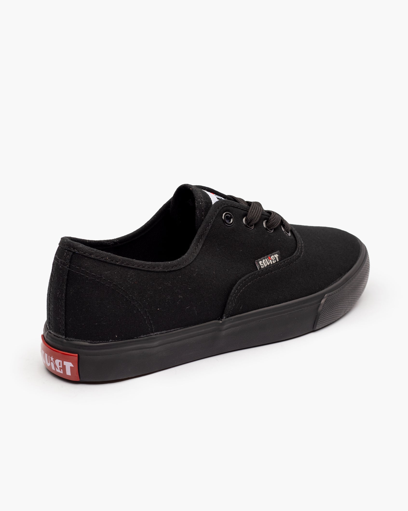Black low-top canvas sneaker with rubber cup sole and side stitching detail