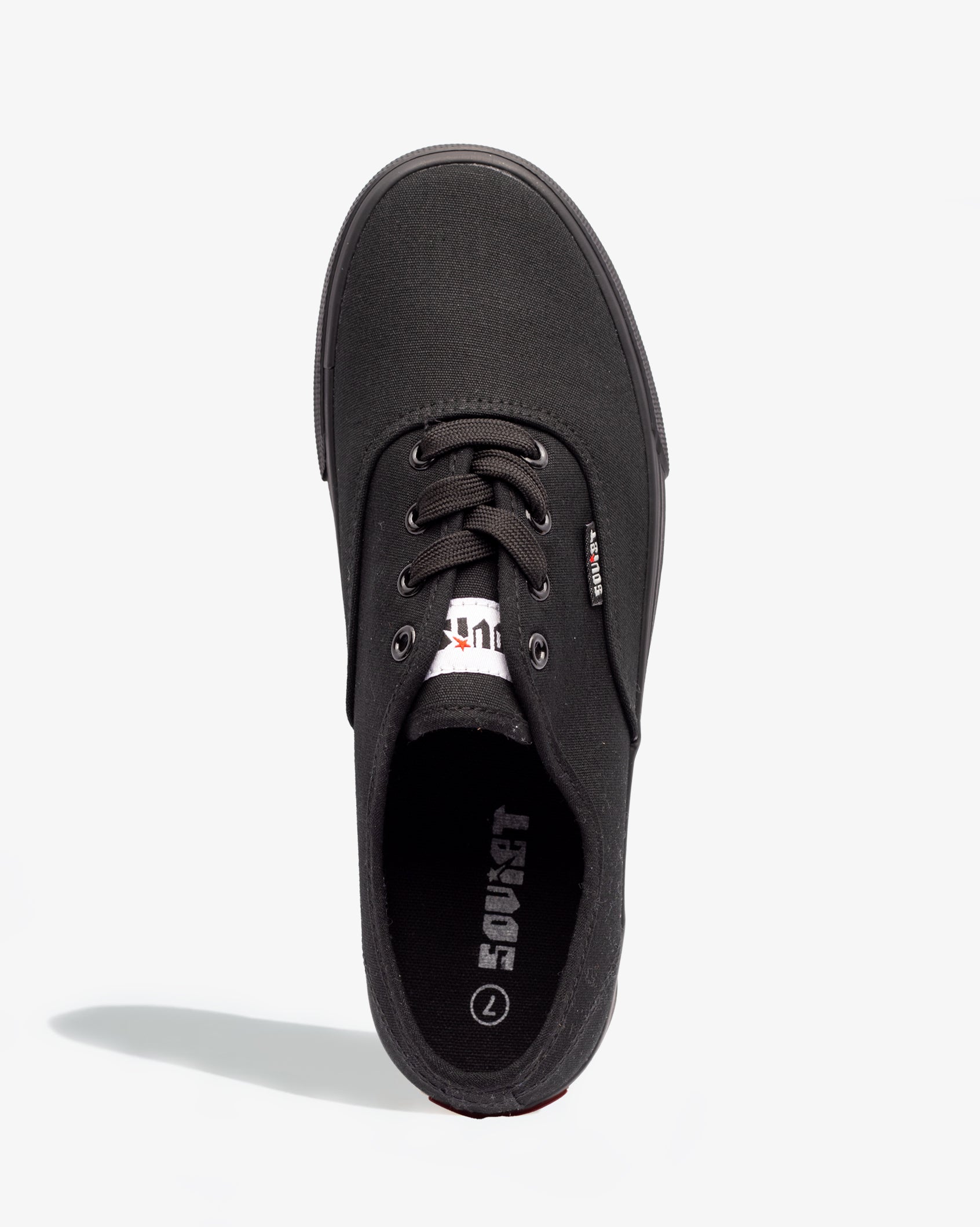 Black low-top canvas sneaker with lace-up front and padded inner lining
