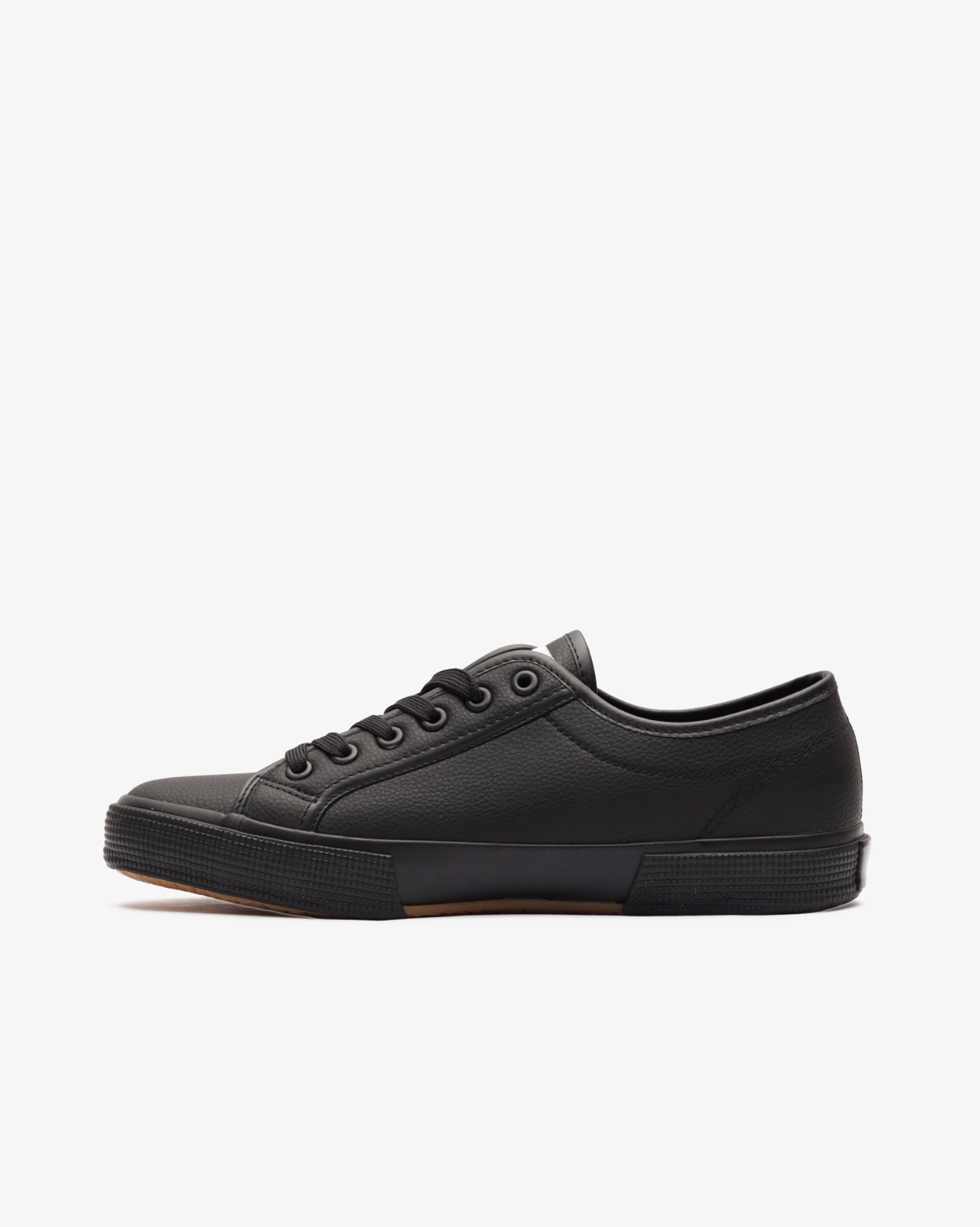 Men's low-cut PU sneaker, black side view with circular eyelets and textured sole