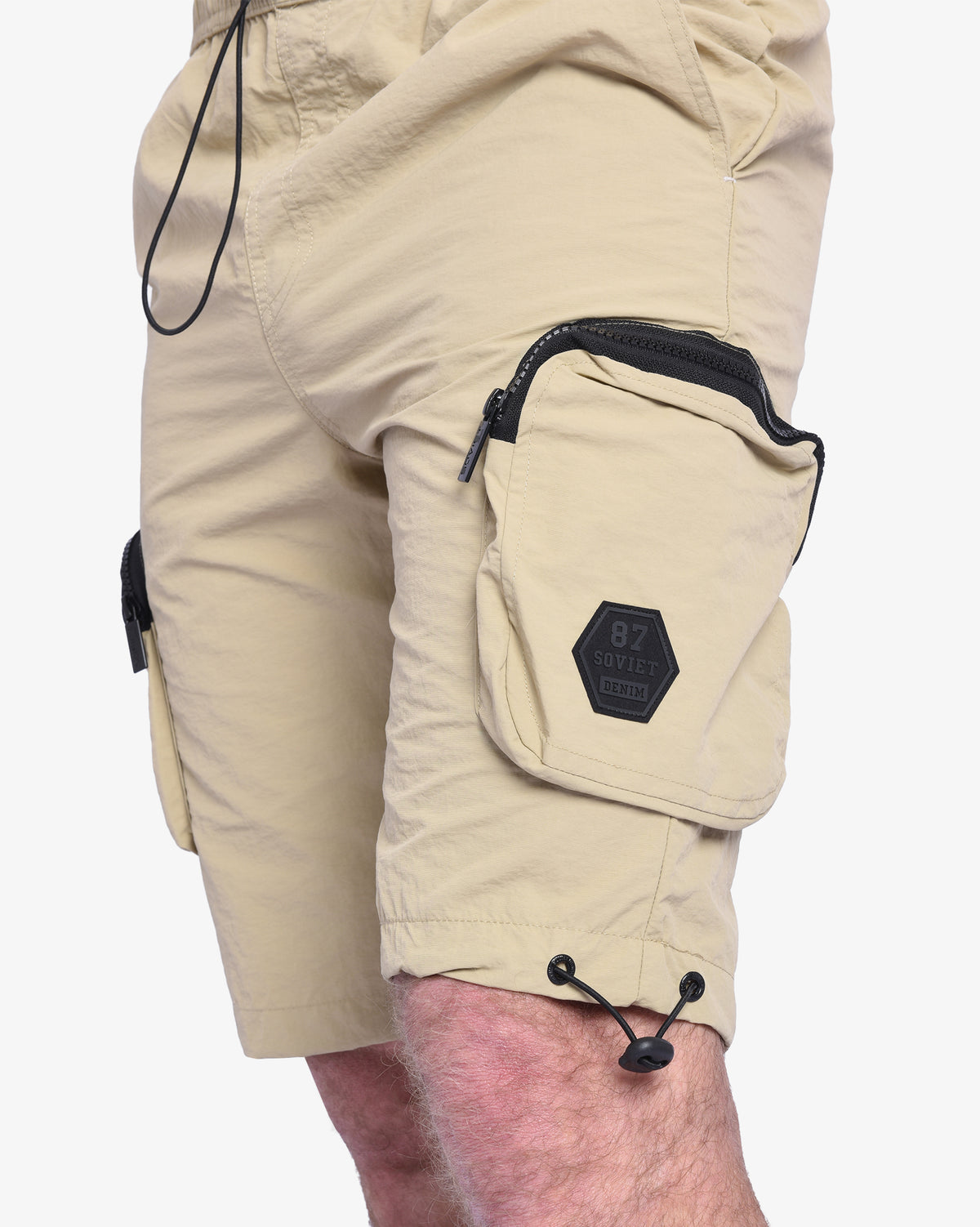 Men's Soviet Baraka nylon track shorts in khaki, featuring an athletic design and adjustable waistband, ideal for sports and casual wear.