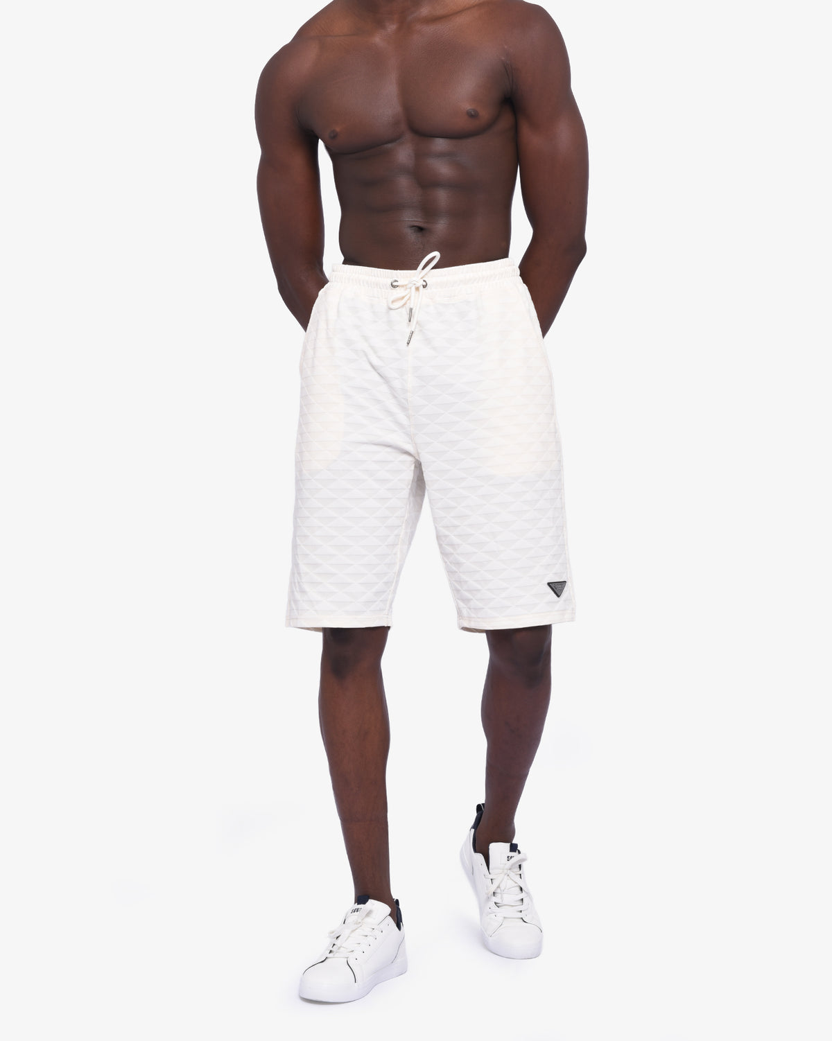 Men's Soviet Ford track shorts in cream color, lightweight athletic apparel with logo detailing, designed for active wear.