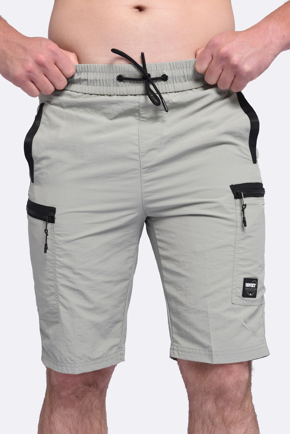 Men's Soviet Roshi track shorts in sage green, lightweight athletic apparel with an elastic waistband and sporty design.
