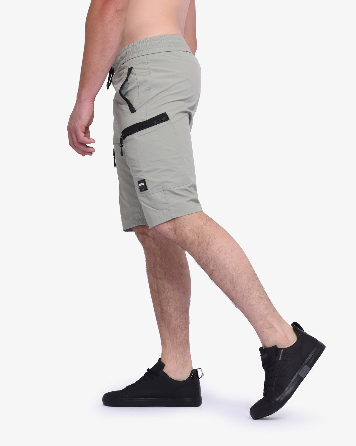 Men's Soviet Roshi track shorts in sage green, made from lightweight athletic fabric with elastic waistband and side pockets.